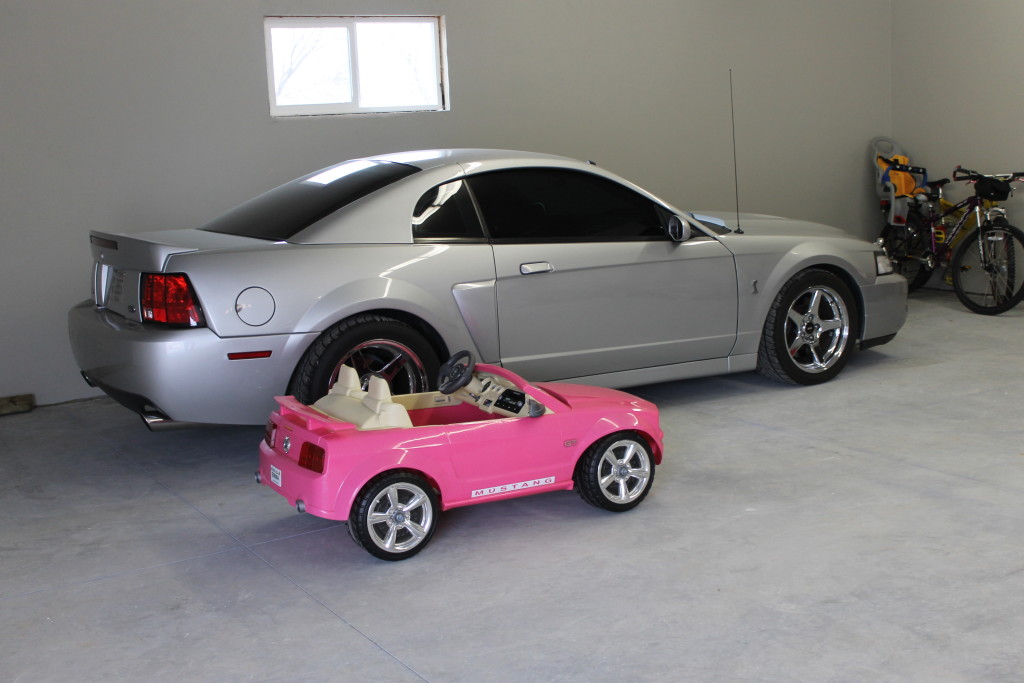 Mustangs in garage