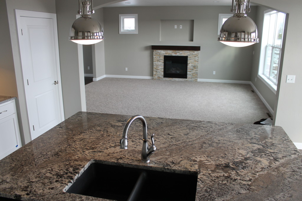 H granite island with industrial pendants