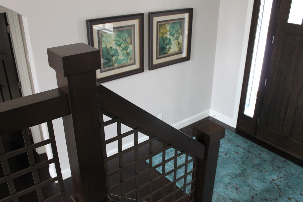 foyer with turquoise rug