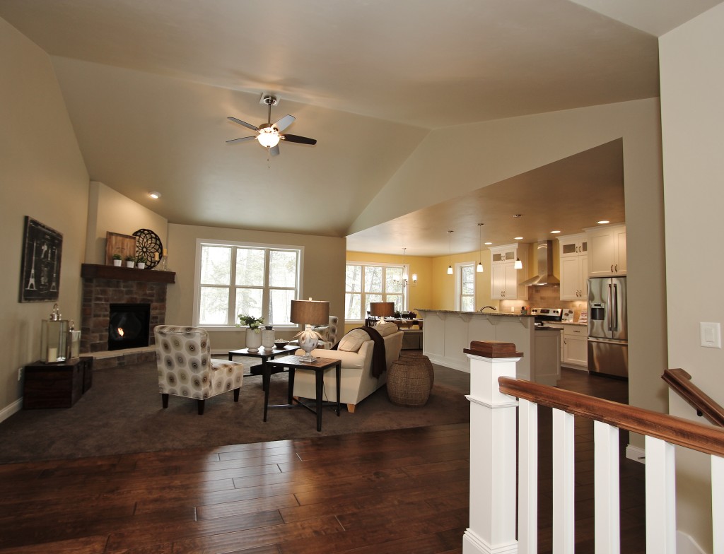 maple living room with cathedral ceiling