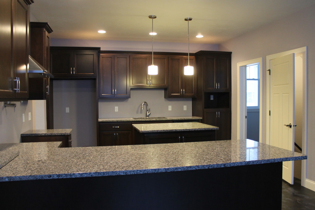 grey granite with espresson cabinets