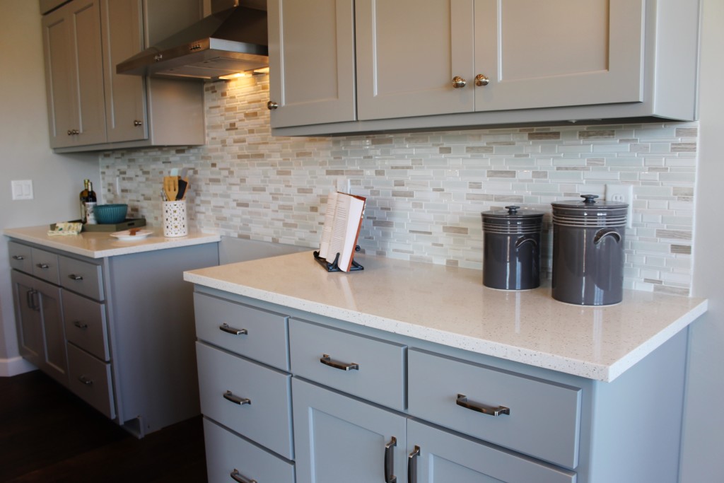 grey cabinets with mosaic backsplash