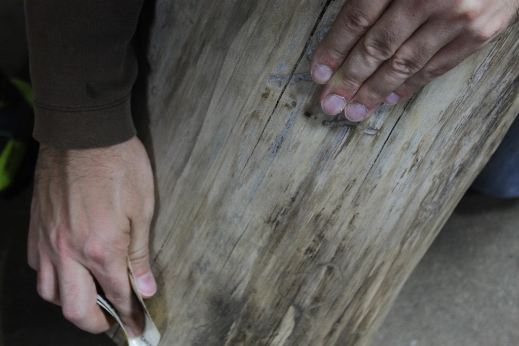 and sanding the log table