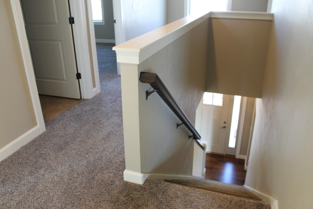 5332 upstairs hallway with painted half wall and stained rail