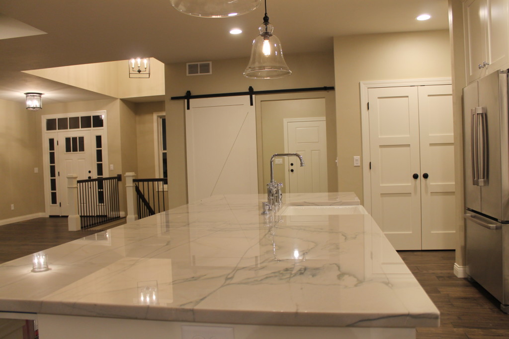 bright white farmhouse kithen with barn doors