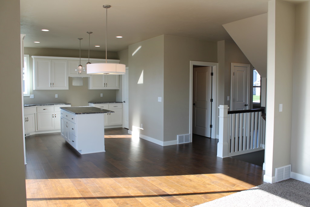 open concept kitchen with stairs open to lower level 5951 daffodil