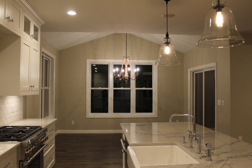 open conept dining room with cathedral ceiling