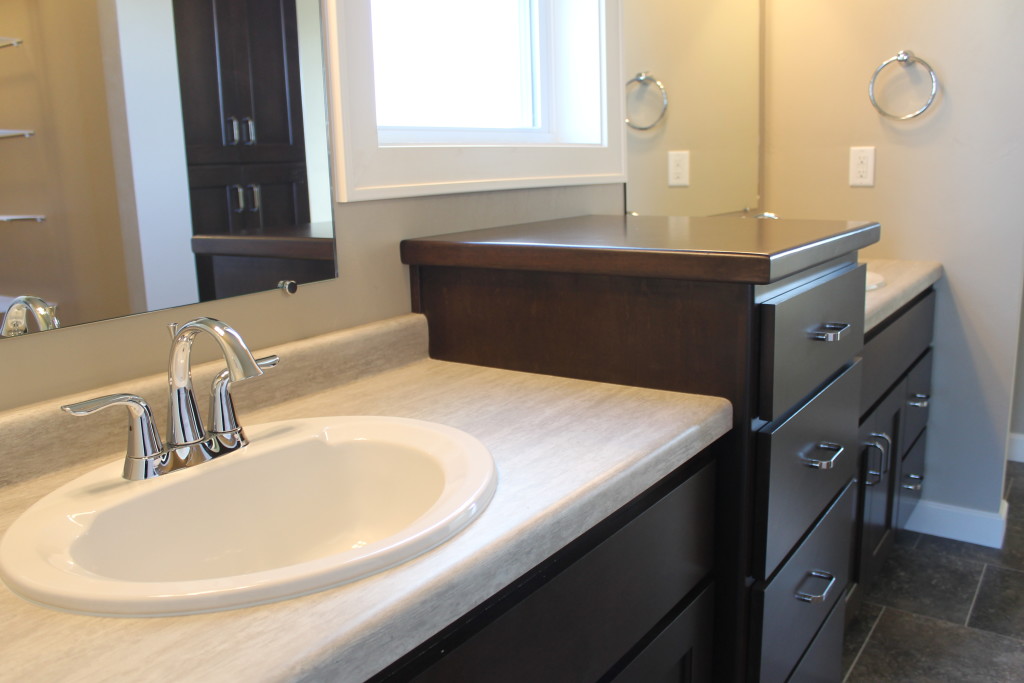 sink between windows and raised linen in master bath