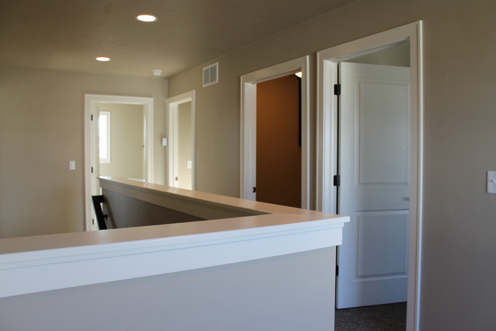 upstairs hallway with half wall