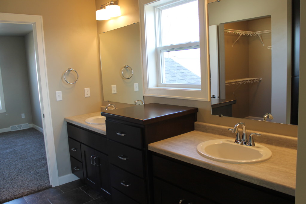 window between bathroom sinks