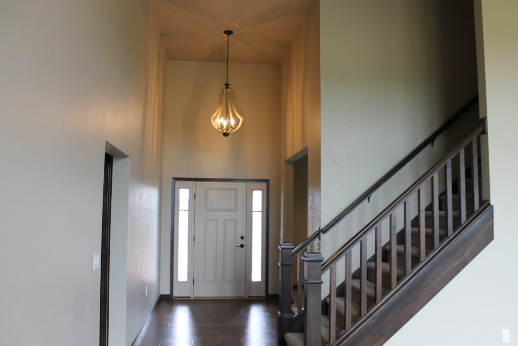 foyer with open stairs and light at amethyst