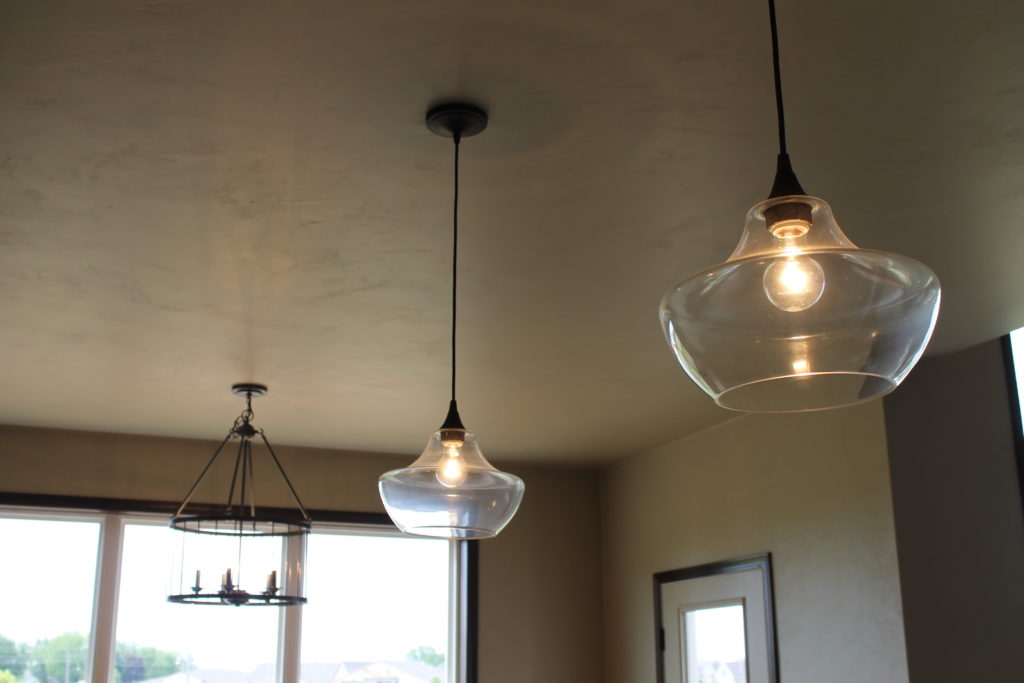 glass pendant lights over island