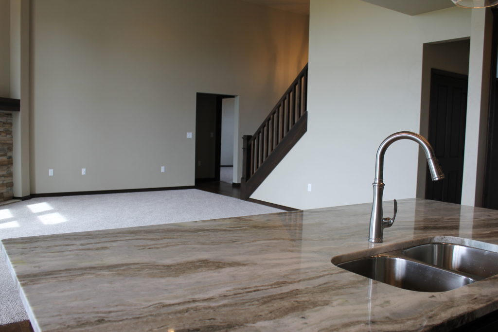 granite island with undermount sink at juniper on amethyst