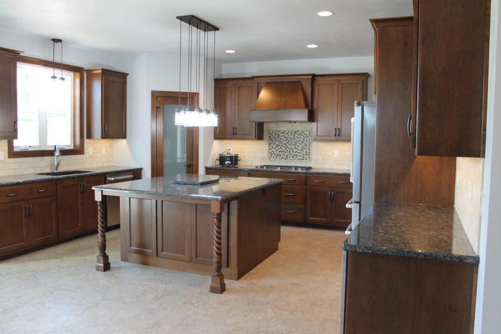 dake custom kitchen with center island and decorative backsplash