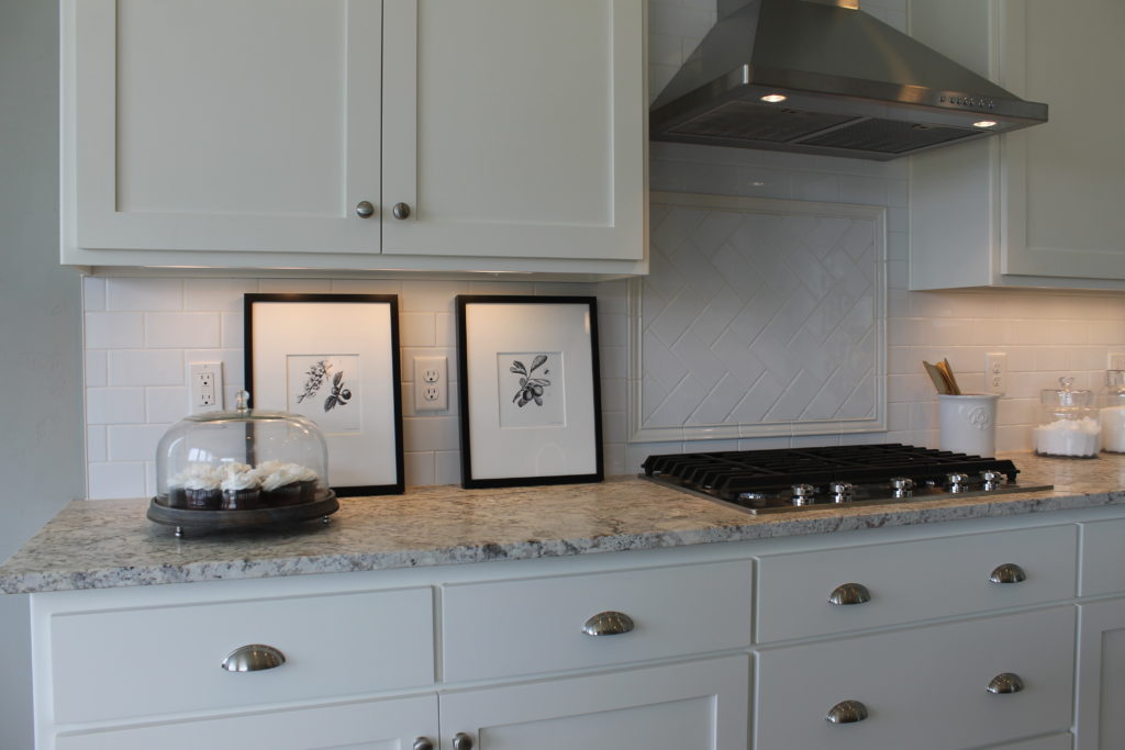 black and white pictures in a black and white kitchen