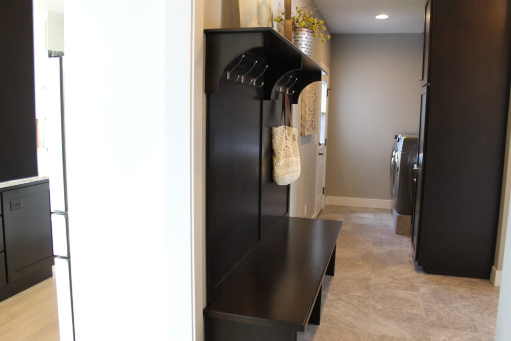 open concept laundry and mud room with door to the outside