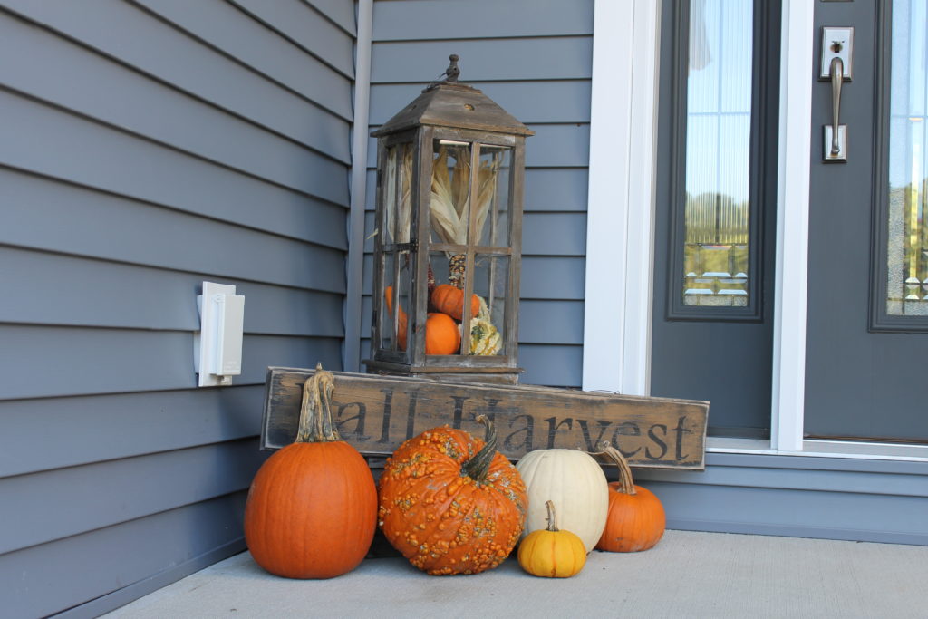 exterior-of-millers-house-with-hay-bale-by-front-door