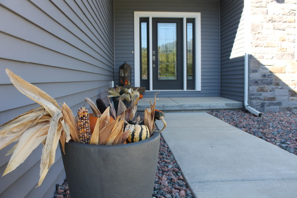 exterior-of-millers-house-with-pumpkins-in-planters