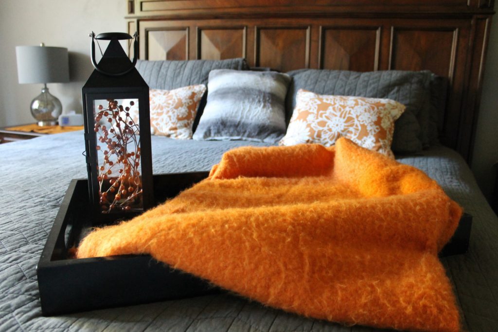 master-bedroomwith-lantern-and-orange-throw