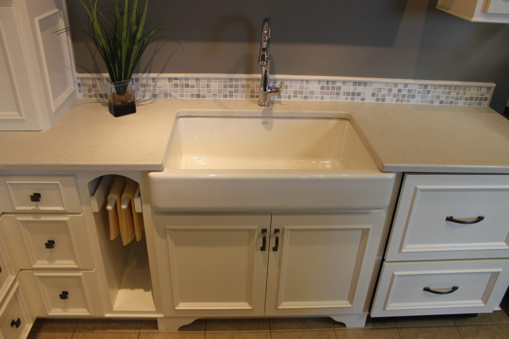 white-farmhouse-sink-with-white-cabinets