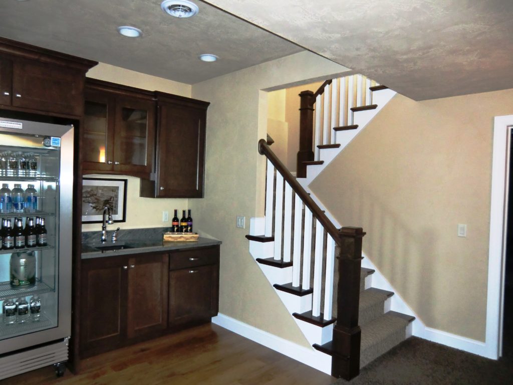 small-bar-area-tucked-under-a-u-shaped-stairs